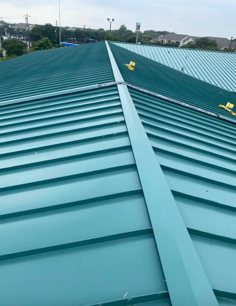 Green commercial metal roof ridge and valley for Metal Roof Repair in Galt